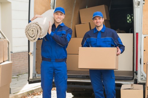 Professional packers efficiently organizing items in Finchley Storage